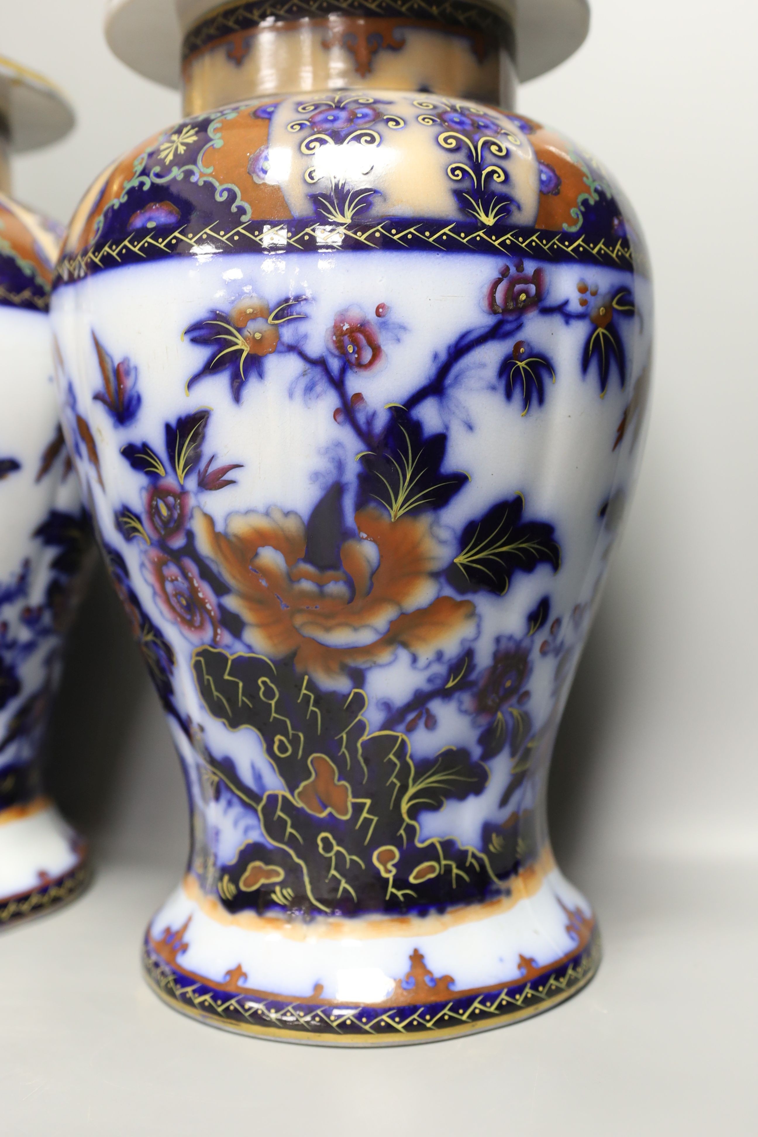 A pair of mid 19th century ironstone vases and covers - 51cm tall